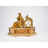 A late 19th century French gilt spelter and alabaster mantel clock