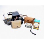 A collection of mid-late 20th century cameras and accessories