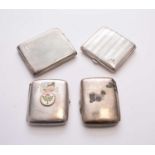 A collection of four silver cigarette cases