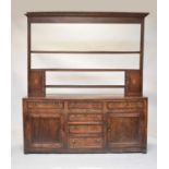 An 18th century Welsh cross-banded oak dresser and rack