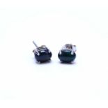 A pair of Ethiopian cabochon black opal stud earrings