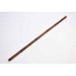 An early 20th century bamboo walking stick, possibly a 'drinking' example