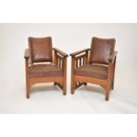 A pair of 20th century armchairs in the manner of Gustav Stickley