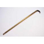 A 20th century novelty, 'fishing rod', brass walking stick