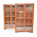 A pair of South East Asian hardwood glazed bookcases
