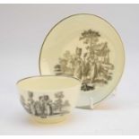 A Worcester tea bowl and saucer, circa 1765, transfer-printed in black with the 'Milkmaids' pattern,