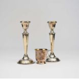 A pair of silver mounted candlesticks