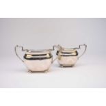 A silver sugar bowl and cream jug