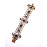 An Austro-Hungarian white metal garnet and enamel bracelet