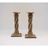 A pair of silver plated candlesticks