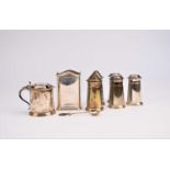A collection of silver cruets and condiment bottle mount