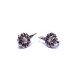 A pair of rose cut diamond set earrings