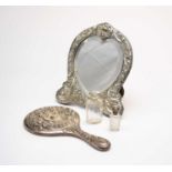 Two silver mounted mirrors and two silver mounted bottles