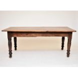A 19th/20th century rustic oak refectory type table