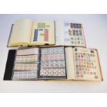 A collection of stamps in four albums