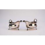 A pair of silver sauce boats