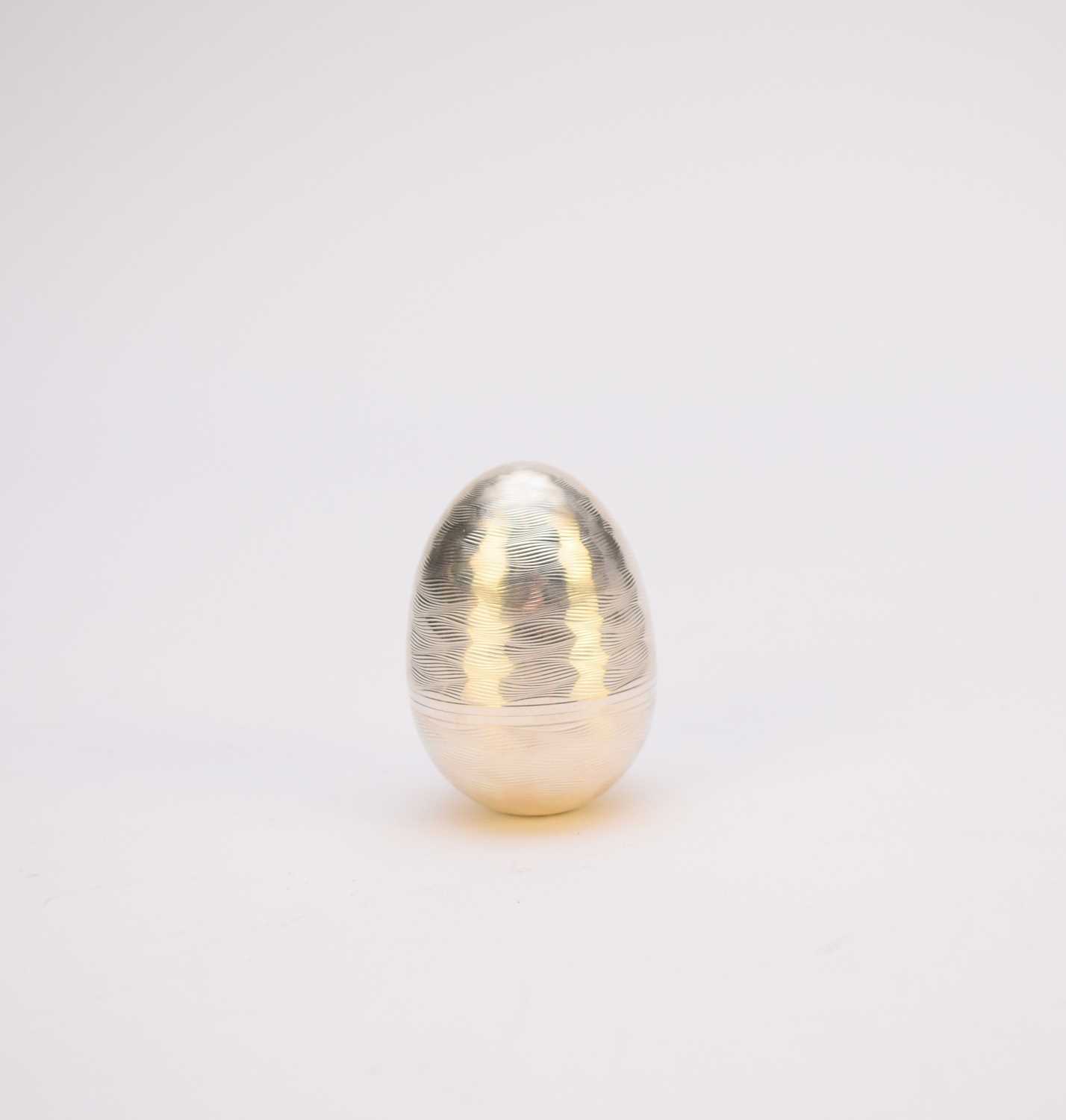 A Nicholas Plummer silver and gilt surprise egg