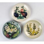 Six Moorcroft pin dishes including 'Fruit Garden' and 'Tigris'