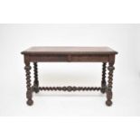A Victorian, 17th century style, oak writing table, by Edwards and Roberts