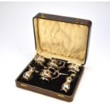 A cased set of George III style silver cruets