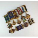 An assorted collection of gilt metal and polychrome enamel Masonic badges