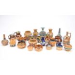 A collection of Royal Doulton and Doulton Lambeth, predominantly miniatures