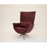 A modern Scandinavian leather and aluminium armchair