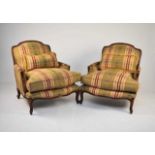 A pair of reproduction Louis XVI style upholstered mahogany armchairs
