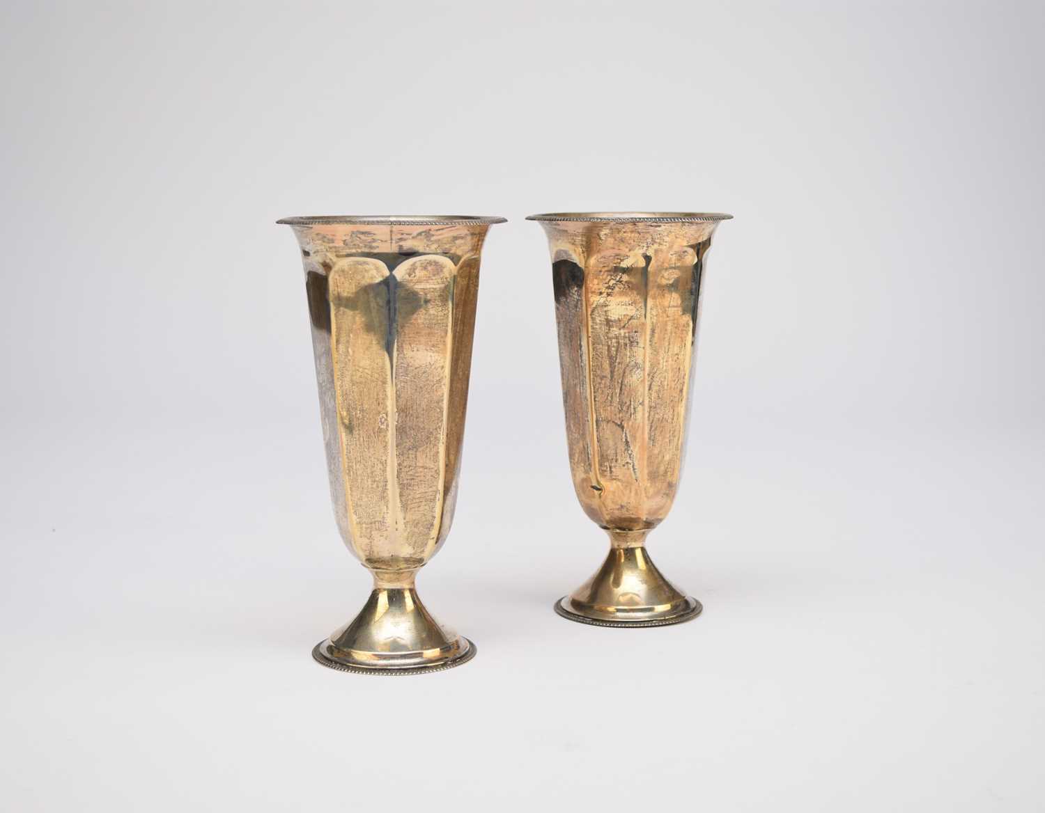 A pair of George V silver mounted vases