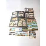 A large collection of postcards to contemporaneous albums with others loose