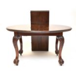 A 1920s, Chippendale style, mahogany telescopic, extending dining table