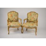 A pair of reproduction fauteuil armchairs