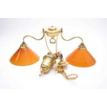 A brass and glass bistro-type adjustable ceiling light