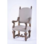 A 19th century continental carved giltwood open armchair