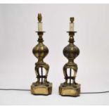 A pair of antiqued brass table lamps