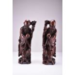 A pair of Chinese carved wood figural lamps, Qing Dynasty