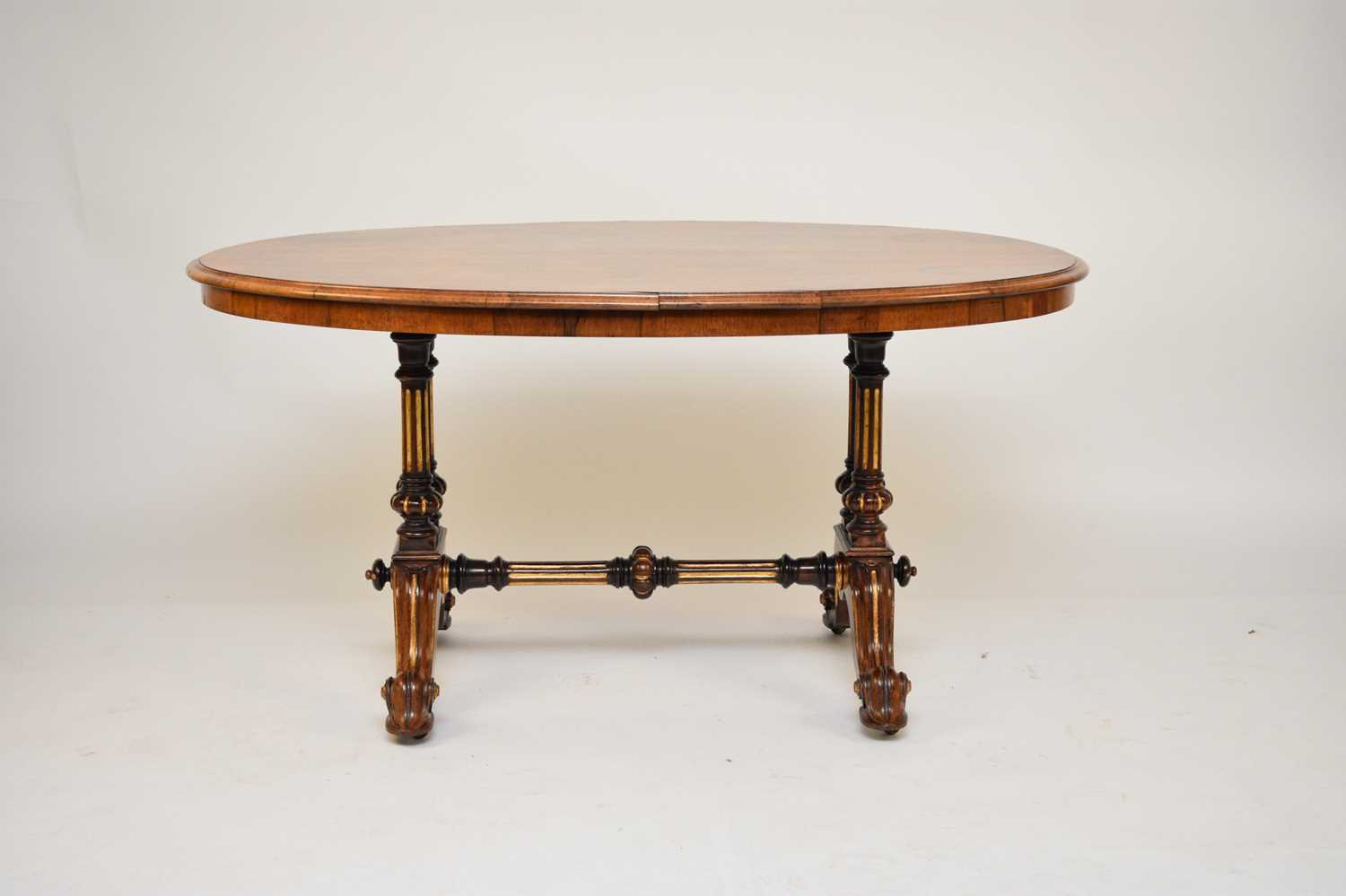 A Victorian walnut oval centre table