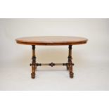 A Victorian walnut oval centre table