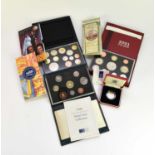 A collection of U.K. proof coin sets