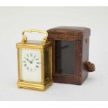 A French gilt brass carriage clock with carrying case