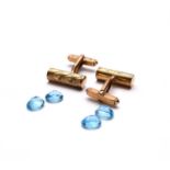 A pair of 9ct gold cufflinks and four loose blue topaz