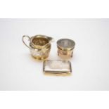 A silver trinket box, cream jug and cigarette case