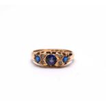 A Victorian 18ct gold seven stone sapphire, diamond and blue paste ring