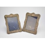 A pair of Edwardian silver photograph frames