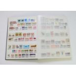 World mix of stamps in blue SG stockbook