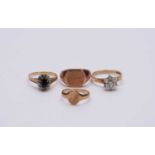 A collection of four 9ct gold rings