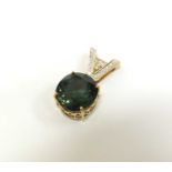 An 18ct gold green tourmaline and diamond pendant