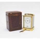 A French gilt brass carriage alarm clock with carrying case