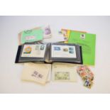Box containing envelopes / packets of stamps and covers from around the world