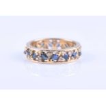 An 18ct gold untested sapphire and diamond eternity ring